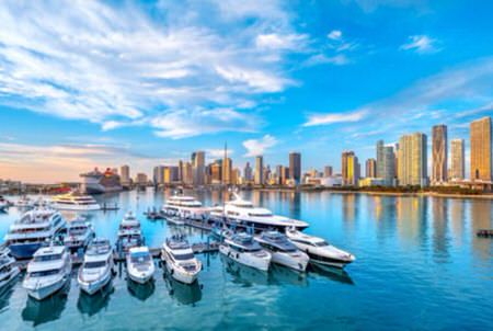 miami marina with boats and skyline, east coast florida vacation home destinations