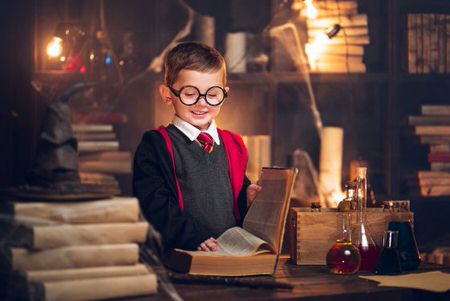 child in wizarding costume at orlando best theme park attraction